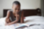 Black woman reading a comic book