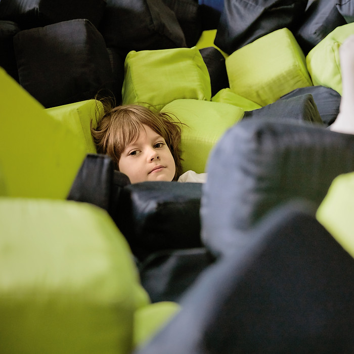 Boy Lying in Soft Cubes