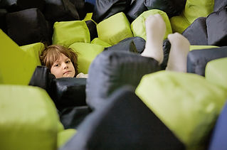 Child Among Cushions