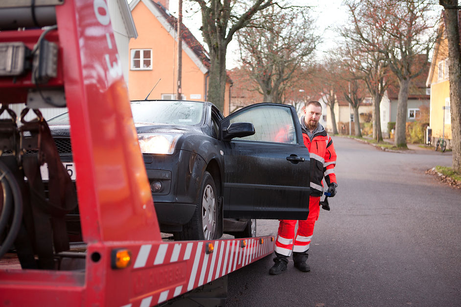 vehicle being transported using a tow truck