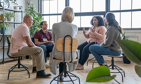 A group of people gathering in a circle for a discussion.