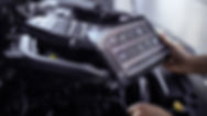 Mechanic with tablet performing diagnostics