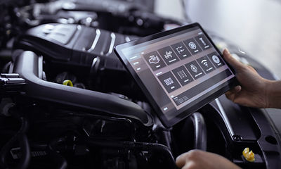 OBD2 scanner checking engine and transmission codes during inspection in Orange County