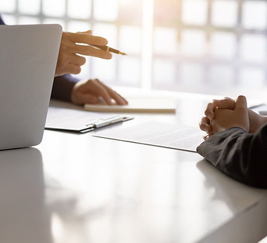 Two men sit in front of each other