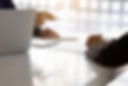 Two men sit in front of each other