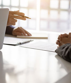 Two men sit in front of each other