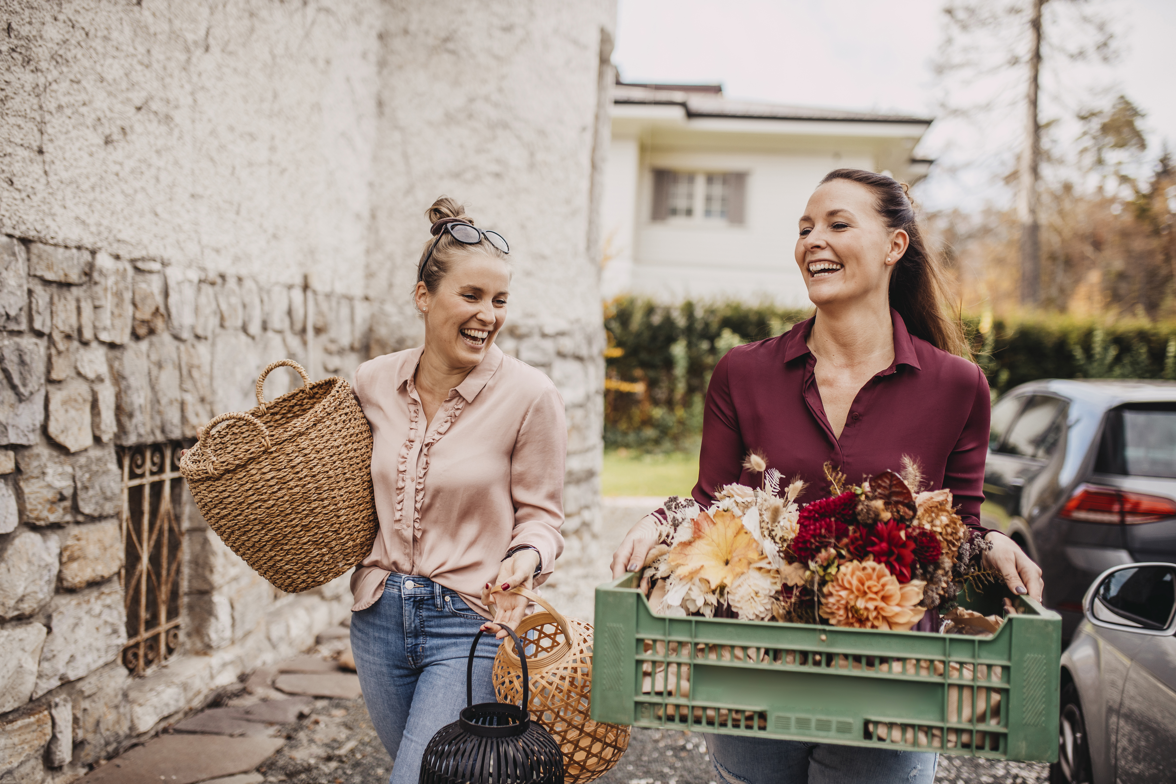 Women Carrying Flowers