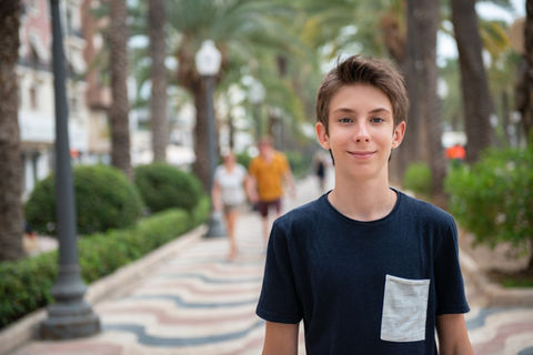 a teenage boy smiling at the camera