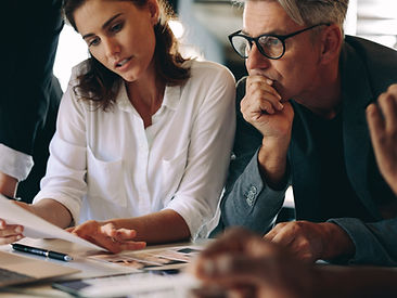 A woman staff member presenting her ideas to her team