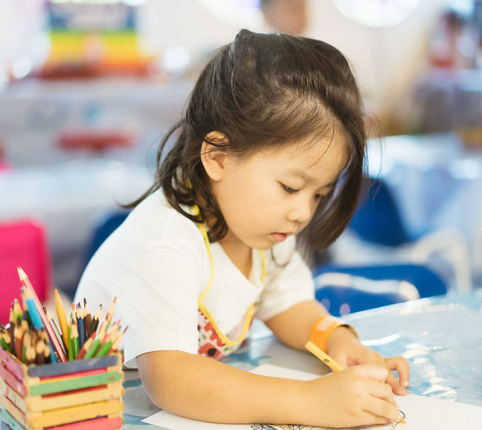 Kid Drawing With Colored Pencil