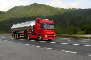Red tanker lorry on a motorway