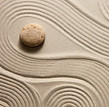 Raked zen garden with smooth stone, evoking the calm clarity and intentional balance Vital Coaching brings to organizational consulting