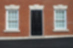 Exterior and doorway of an English red brick house