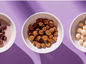 Three bowls full of snacks