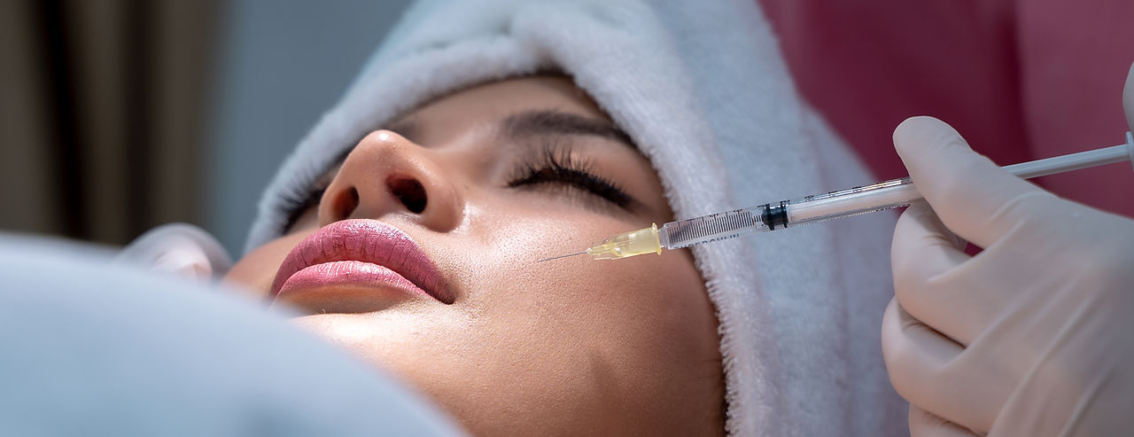 A woman getting filler injection