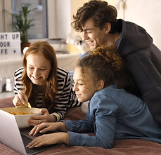 Teenagers looking at laptop