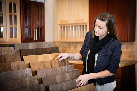 Woman shopping for flooring in a home interiors store
