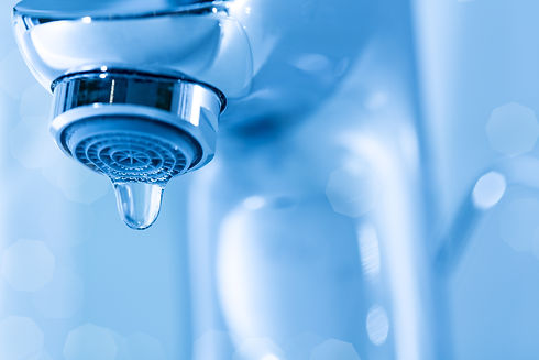 Tap closeup with dripping waterdrop. Water leaking, saving concept