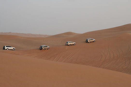 SUVs on Desert Dunes