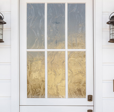 Cropped detail of white door to classic home