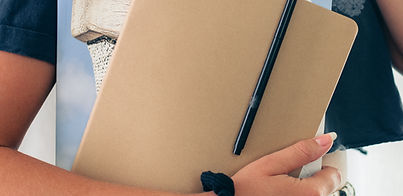 Person Holding Notebook