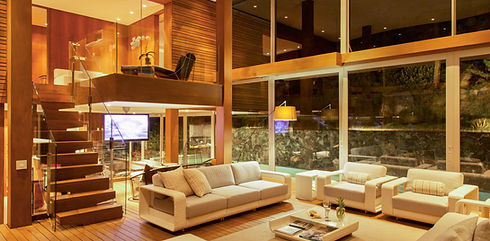 Illuminated modern living room at night