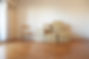 A stack of cardboard boxes in an empty room