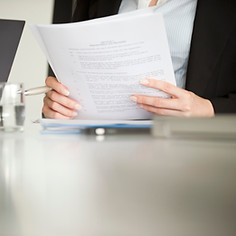 Executive reviewing a document, cropped