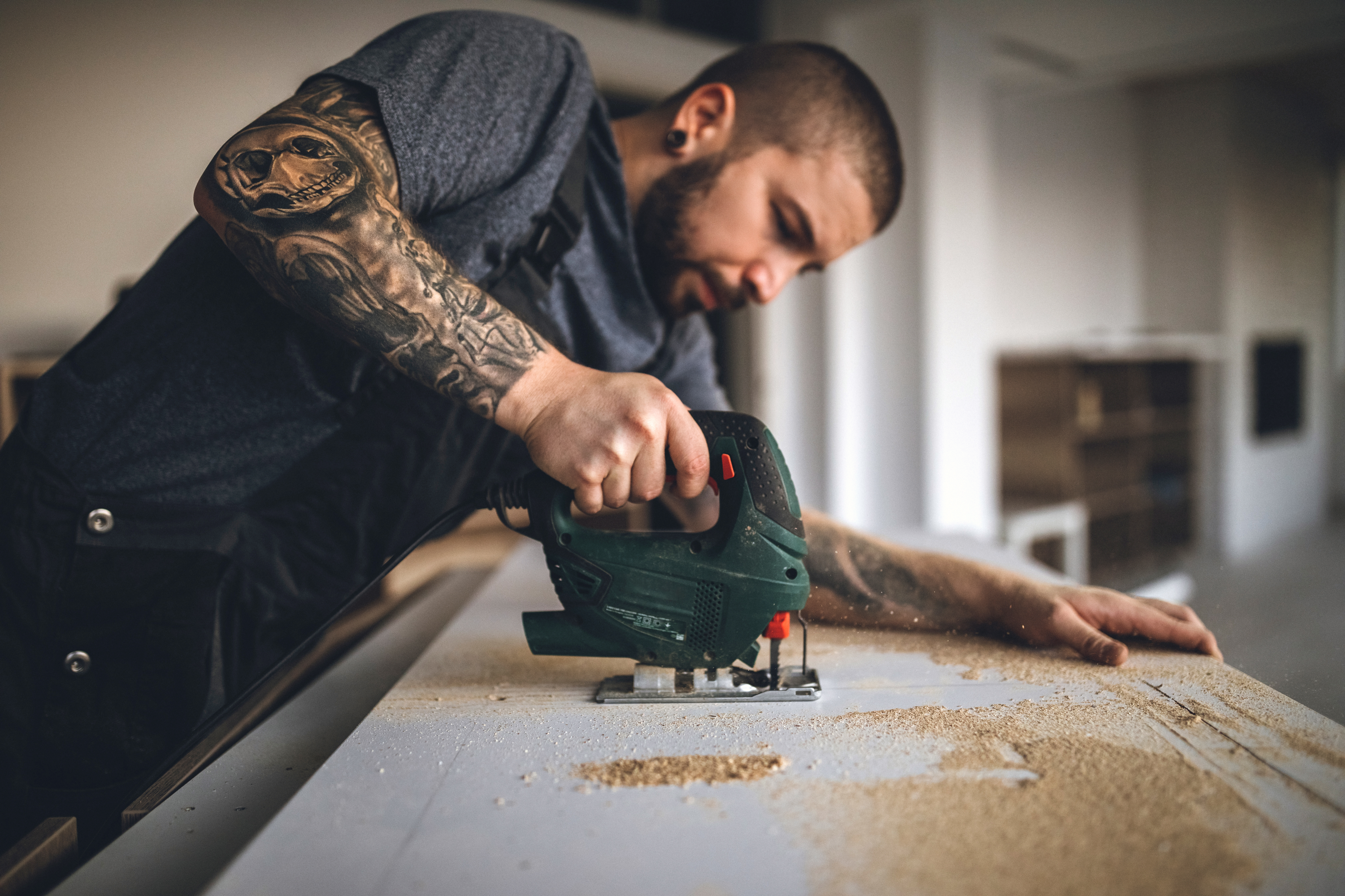 Man Cutting Wood in his business