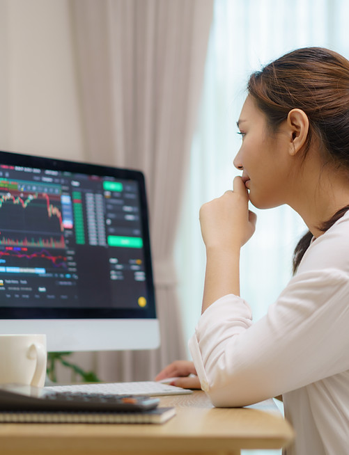 A woman analysing stocks