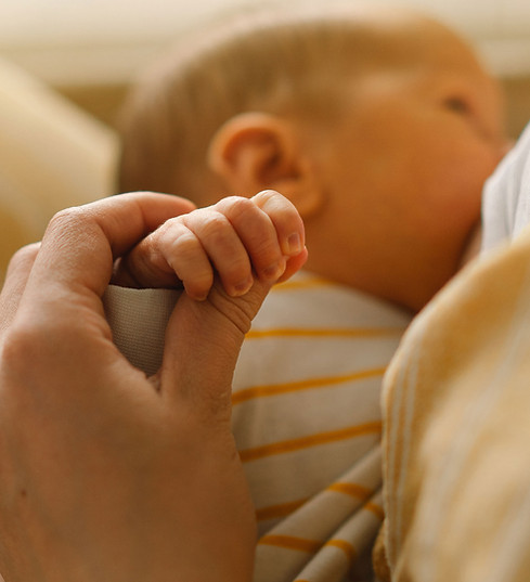 Mother Holding Baby's Hand