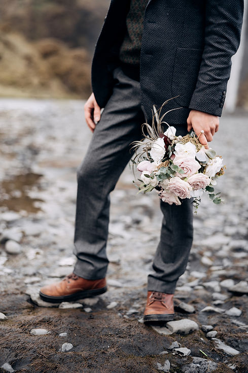 Bridegroom Holding Bouquet