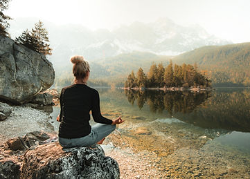 Person meditating in nature for their daily practice