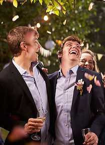 Two grooms celebrate in an evening wedding