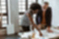A Man and a Woman looking at a Design