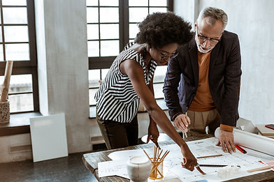 A Man and a Woman looking at a Design