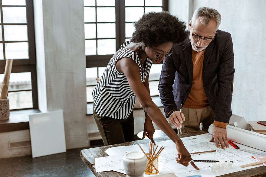 A Man and a Woman looking at a Design