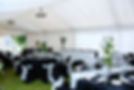 A tent adorned with black and white table cloths