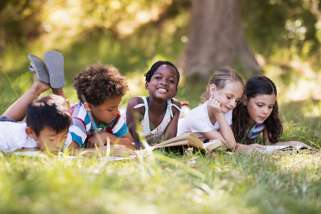 Children Reading Outdoors