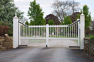 white wooden gates of a property