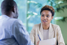 Employer speaking with job candidate about their employment background check
