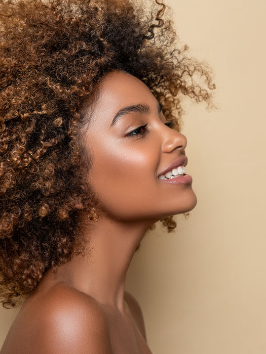 Smiling woman with curly hair