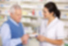 American pharmacist serving senior man in pharmacy
