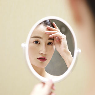 a person doing mirror work