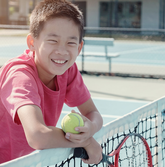 Boy on a Tennis Court