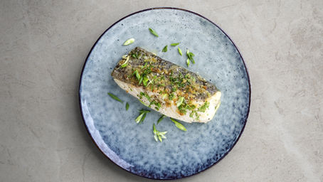 Grilled barramundi fillet with lemon and herbs, perfect for Easter celebrations in Sydney