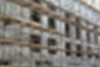 A multi-storey building under renovation is covered with scaffolding
