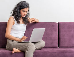 Woman Using Laptop to book a pcos call