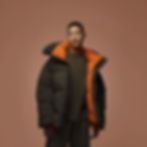 Model in olive and orange puffer jacket(2)