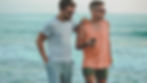 two men walking and talking in French